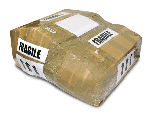 Parcel wrapped in brown paper with fragile label